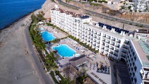 an aerial view of a hotel with swimming pools at Riviera Peace in Mogán