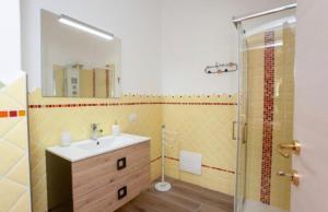 a bathroom with a sink and a shower at Da Claudietto in San Teodoro