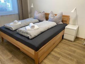Łóżko lub łóżka w pokoju w obiekcie Apartmány Mikulčice