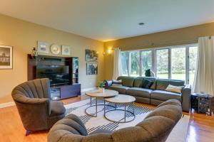 a living room with a couch and chairs and a tv at Warwick Vacation Rental with Private Yard and Fire Pit in Warwick