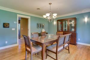 a dining room with a wooden table and chairs at Warwick Vacation Rental with Private Yard and Fire Pit in Warwick