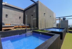 a swimming pool in the backyard of a house at Alta by Wynwood House in Lima
