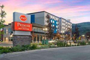 a building with a sign for a premier hospital at Best Western Premier Route 97 Vernon in Vernon