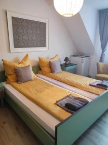 two beds in a small room with at Mosel Boutique in Bruttig-Fankel