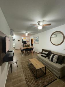 a living room with a couch and a table at Departamento Altata Punta Paraiso in Altata