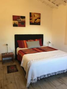 מיטה או מיטות בחדר ב-Casa Loro