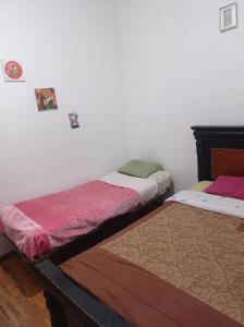 Letto o letti in una camera di Don Pablo