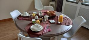 a dining room table with a plate of food on it at Ker Paula in Plessala