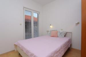 Posteľ alebo postele v izbe v ubytovaní Apartments with a parking space Brela, Makarska - 789