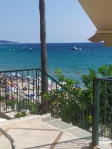 a view of the beach from the balcony of a resort at Blue Beach Siviri Chalkidiki in Siviri