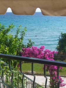a view of the ocean from a balcony at Blue Beach Siviri Chalkidiki in Siviri