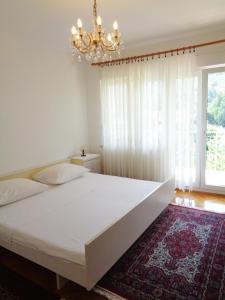 Postel nebo postele na pokoji v ubytování Apartment Moscenicka Draga 2327c