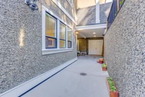 a hallway of a house with a window and a building at Crescent Beach is a walk away from Casa Altamira! in Surrey