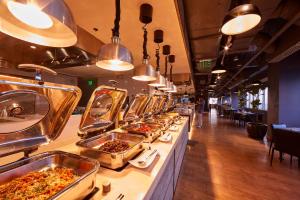 a buffet line with many trays of food at Brittany Hotel BGC in Manila