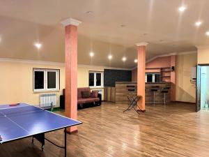 a living room with a ping pong table in it at Awesome Large 3 Floor Villa Dilijan , 8 Bedrooms+4.5 Bathrooms+Swimming Pool, Nice Mountain View in Dilijan