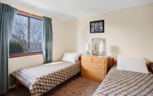 Ένα ή περισσότερα κρεβάτια σε δωμάτιο στο Comfortable Elevated Holiday Home