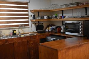 Cuisine ou kitchenette dans l'établissement Casa Entre Ulmos y Lengas