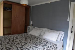 מיטה או מיטות בחדר ב-Casa Entre Ulmos y Lengas