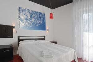 Postel nebo postele na pokoji v ubytování Hotel Silvana
