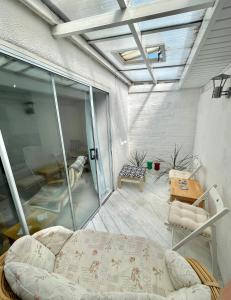 a room with a bed and a glass wall at Apartment in central Exmouth in Exmouth