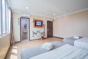 Postel nebo postele na pokoji v ubytování Hotel 28 Titiwangsa