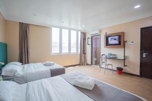 Postel nebo postele na pokoji v ubytování Hotel 28 Titiwangsa + 37 fotografií