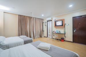 Postel nebo postele na pokoji v ubytování Hotel 28 Titiwangsa