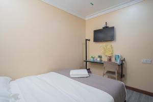 Postel nebo postele na pokoji v ubytování Hotel 28 Titiwangsa