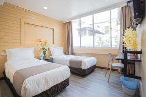 Postel nebo postele na pokoji v ubytování Hotel 28 Titiwangsa