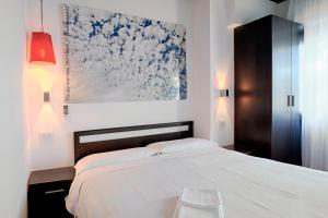 Hotel Silvana tesisinde bir odada yatak veya yataklar