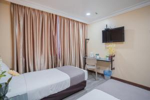 Postel nebo postele na pokoji v ubytování Hotel 28 Titiwangsa