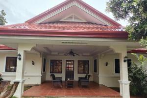 a house with a red roof at DMC2 Residence Panglao in Panglao