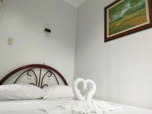 Postel nebo postele na pokoji v ubytování DMC2 Residence Panglao