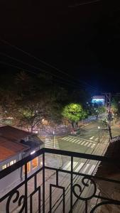 a view of a street at night from a balcony at Hermoso y amplio departamento in Tarija
