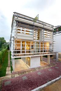 a building that is on top of a building at Ecoloft Jababeka Golf in Cikarang
