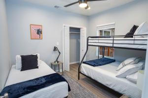 a bedroom with two bunk beds and a mirror at Dont Miss Dynamic 4BR2BA Near Jolly Riverwalk in San Antonio