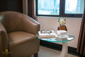 Posezení v ubytování Quang Chung Hotel Le Van Thiem