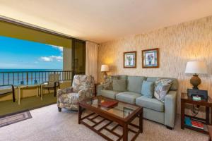 a living room with a couch and a table at SUGAR BEACH RESORT, #326 condo in Kihei