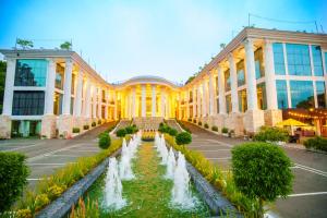 a building with a fountain in front of it at The Epitome in Kurunegala