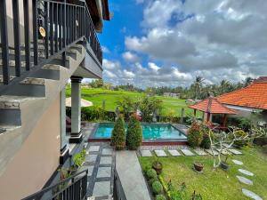 an aerial view of a house with a swimming pool at Bhakti Ubud Villa in Ubud