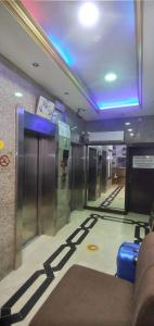 a hallway with a baggage claim area in an airport at Golden Star Hotel in Dubai