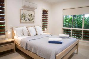 Ένα ή περισσότερα κρεβάτια σε δωμάτιο στο Solitaire - Tropical Style - 3 bedrooms +24 φωτογραφίες