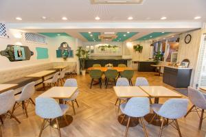 a dining room with tables and chairs in a restaurant at Senkei Plaza in Hakone