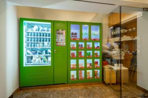a green display case in a store with medicines at Holiday Inn Shanghai Hongqiao Central, an IHG Hotel in Shanghai