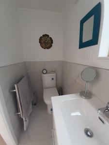 a bathroom with a tub and a toilet and a sink at 15 On Wards in Greytown