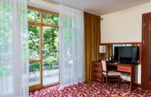 TV a/nebo společenská místnost v ubytování Hotel Violeta
