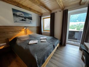Posteľ alebo postele v izbe v ubytovaní Hotel Landhaus Lungau