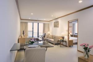 a room with a living room and a bedroom at Riverine Place Hotel and Residence in Nonthaburi