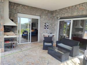 a living room with a couch and a table at Sunset Villa Montenegro in Radovanići