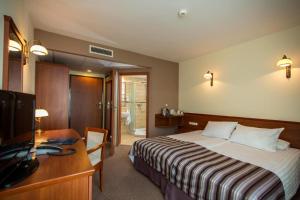 Łóżko lub łóżka w pokoju w obiekcie Hotel Great Polonia Conrad Kraków